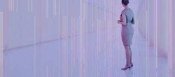 woman standing in futuristic hallway