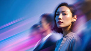 woman highlighted in the crowd