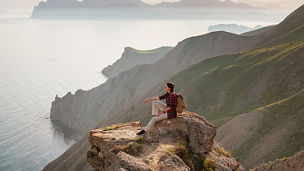 Woman hiking on lakefront