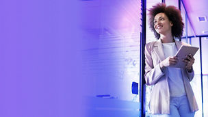 Woman holding a tablet in her hand and smiling