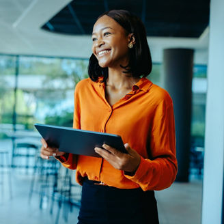 Woman holding tablet and smiling