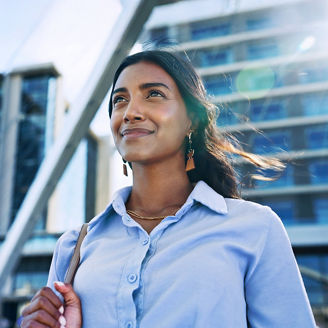 Thinking, low angle and travel with business woman in city for reflection, future and morning commute. Pride, confidence and professional with person in downtown for corporate, vision and memory.