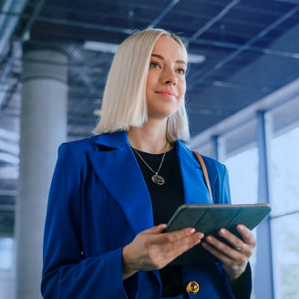 woman holding ipad
