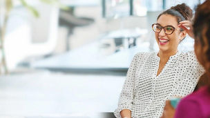 woman-laughing-while-having-conversation