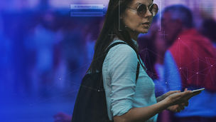 Woman with sunglasses on holding a phone