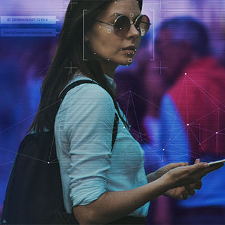 Woman with sunglasses on holding a phone