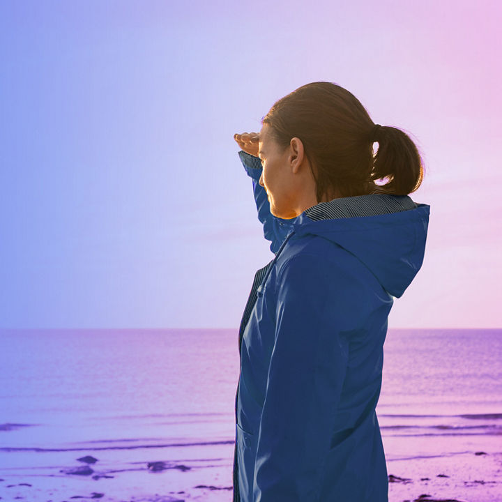 woman looking at sunset