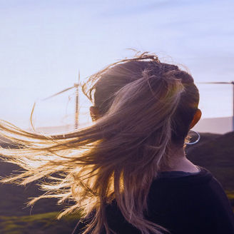 Woman-looking-at-windmills-banner
