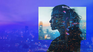 Woman looking out window to city