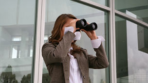 Woman looking through binoculars