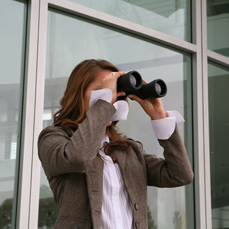 Woman looking through binoculars