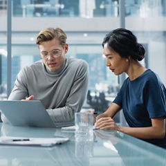 Woman man discussing on office desk