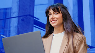 woman with laptop smiling