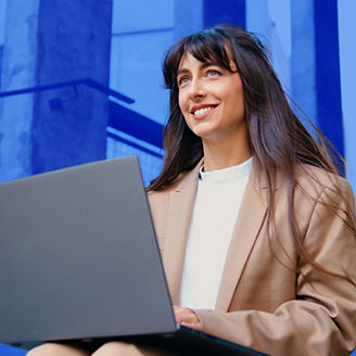 woman with laptop smiling