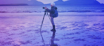 Woman Photographing at Smerwick Harbor during a wonderful sunrise.