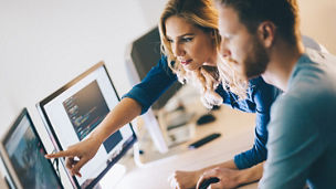 Programmer working in a software developing company office