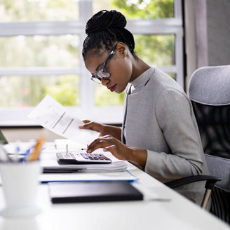 A woman ensuring accuracy through efficient invoice review.