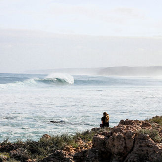 woman sitting near sea