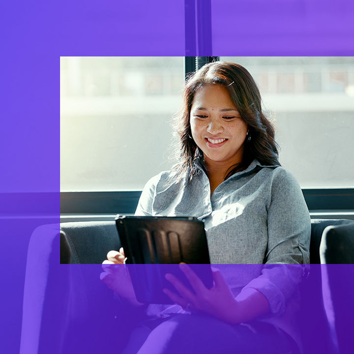 Woman sitting working on an iPad banner