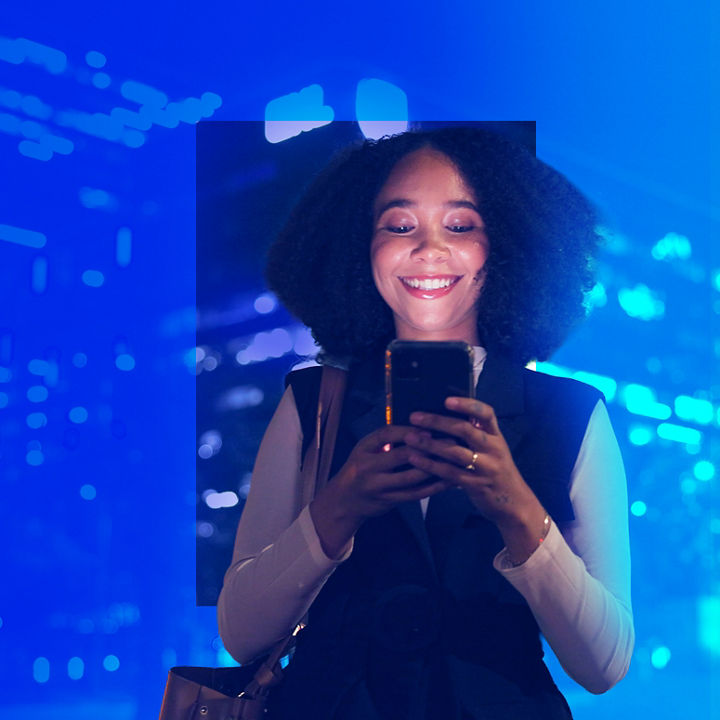 Woman smiling and using mobile