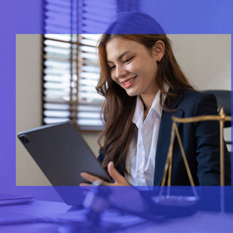 Woman smiling looking at tablet
