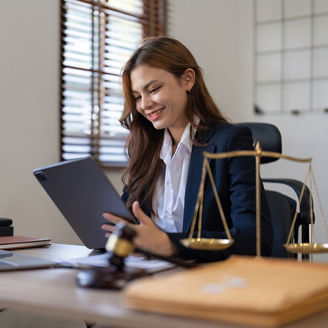 Woman smiling looking at tablet