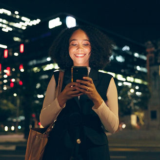 woman smiling looking at the phone