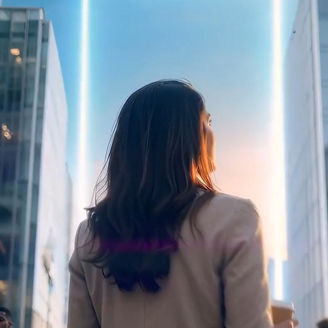 Woman standing between modern office buildings