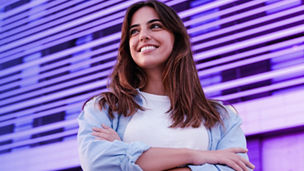 Woman standing in front of the building