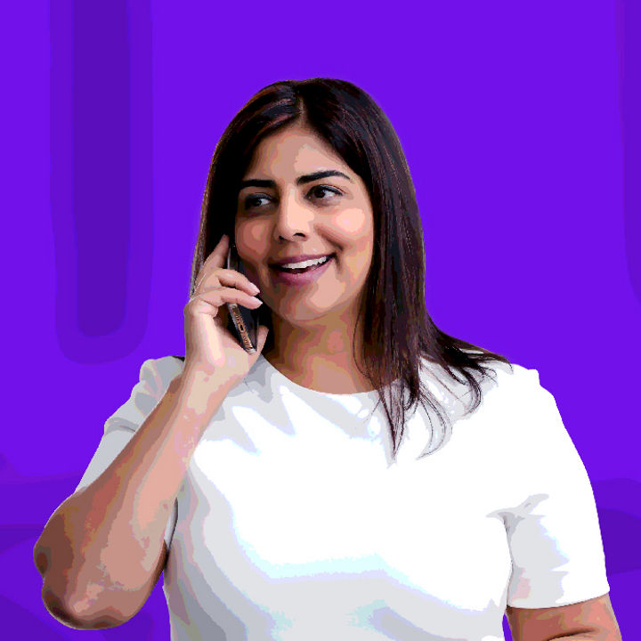 Woman in white talking on cell phone banner