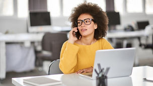 woman talking on phone in office