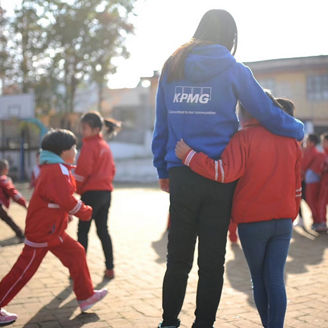 Woman volunteering with children