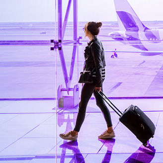woman walking at airport banner