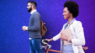Woman with bike walking