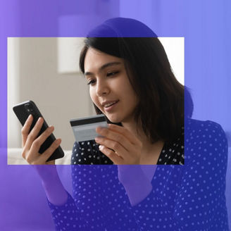 Woman with credit card laughing