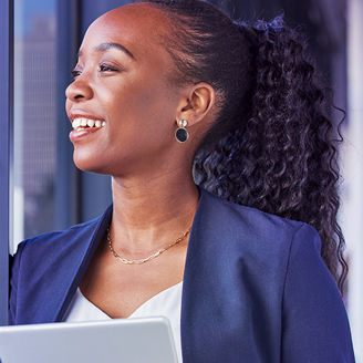 woman with curly hair looking outside window banner