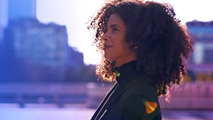 Woman with curly hair smiling