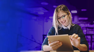Woman with glasses using tablet banner