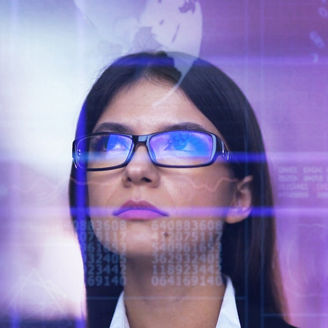 women with spectacles looking at screen