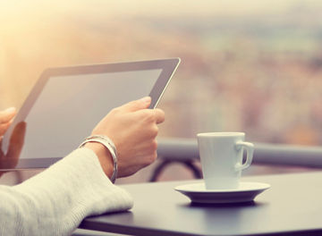 Woman using digital tablet and drink coffee 26