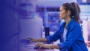 Woman working on computer market