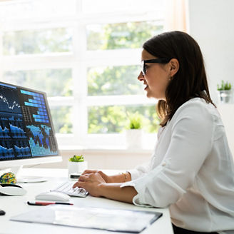 Woman working on digital charts