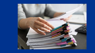 woman working on paper banner