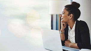 Woman working staring outside