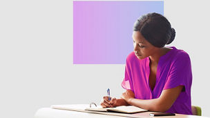 Woman writing in diary