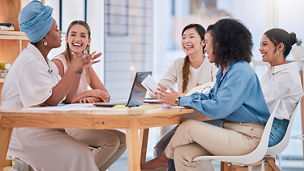 Women having a discussion on table