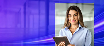 Women holding a tab smiling