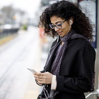 women-listening-to-music-from-phone-via-earphones