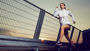 Women running on bridge