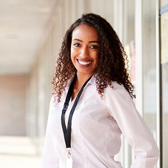 Woman standing in the corridor of a college building